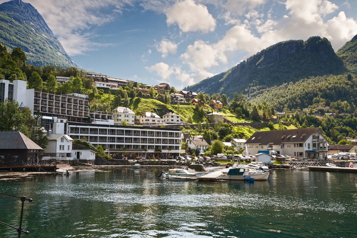Hotels and houses by the harbour in Geiranger, right on the fjord