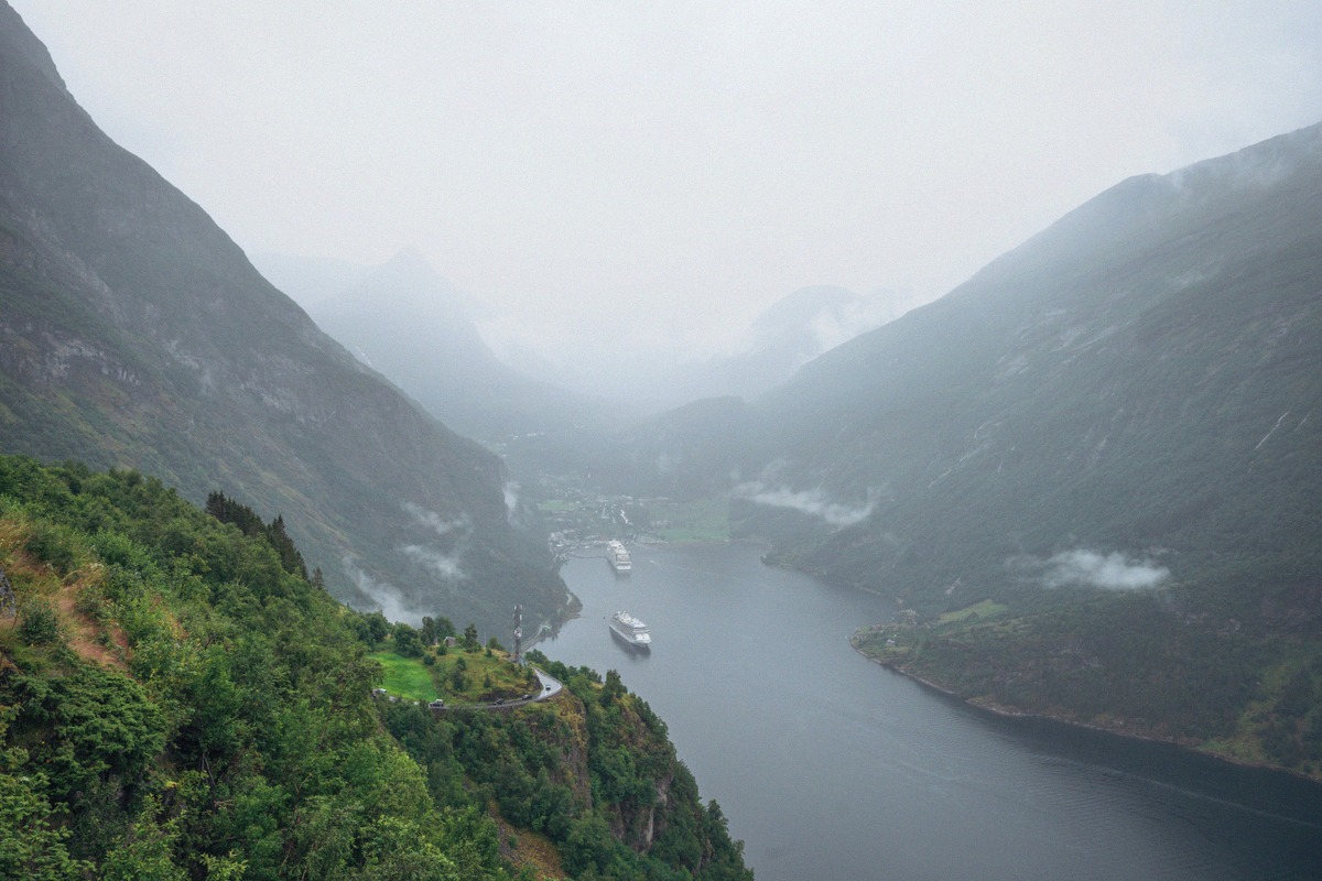 Mist and low cloud over the Geirangerfjord with two cruise ships